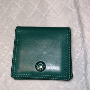 Coach Wallet 8  card slots
4 extra slide pockets
2 bill folds
1 coin snap pocket